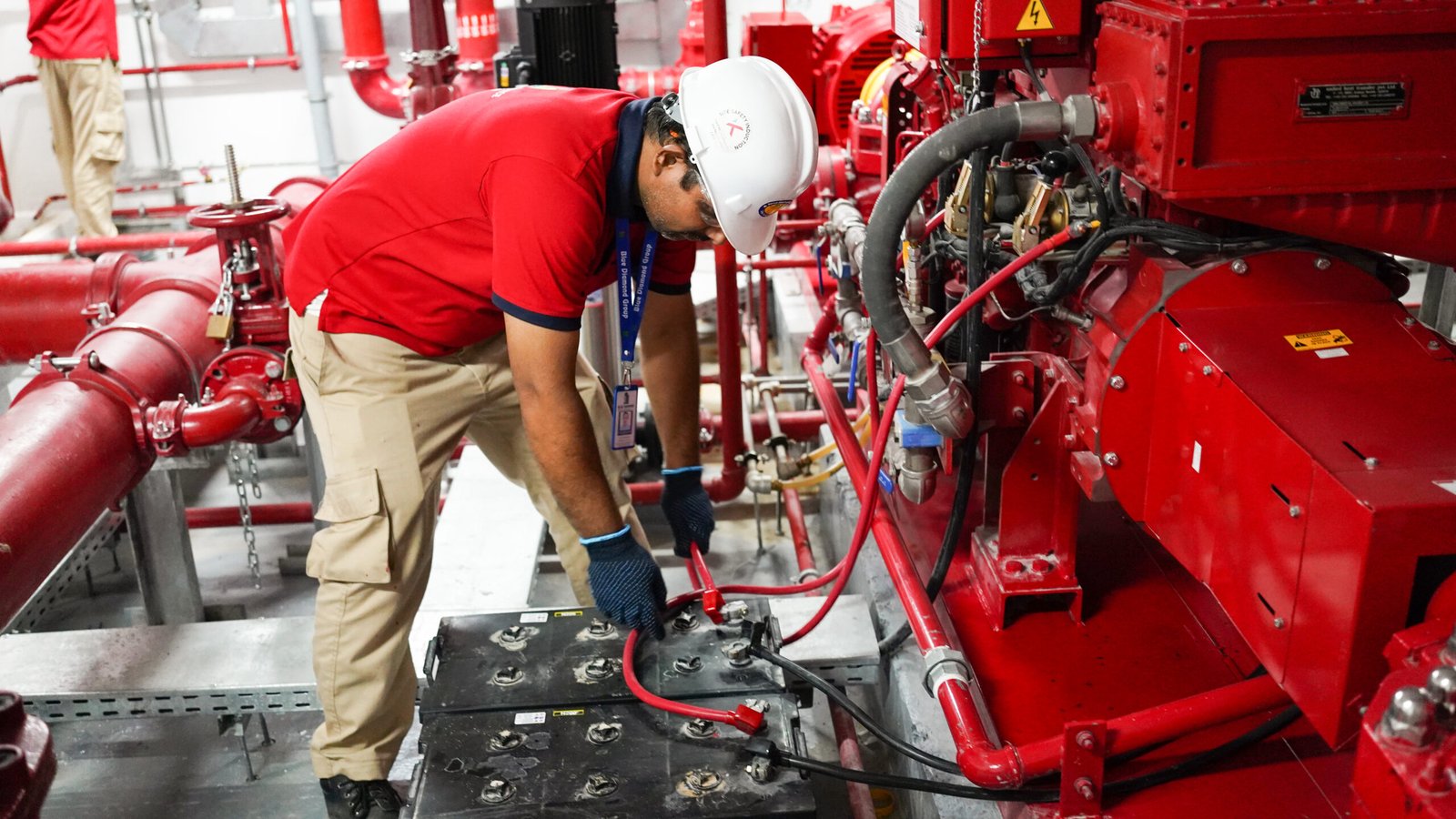 fire protection company UAE technician servicing fire extinguisher